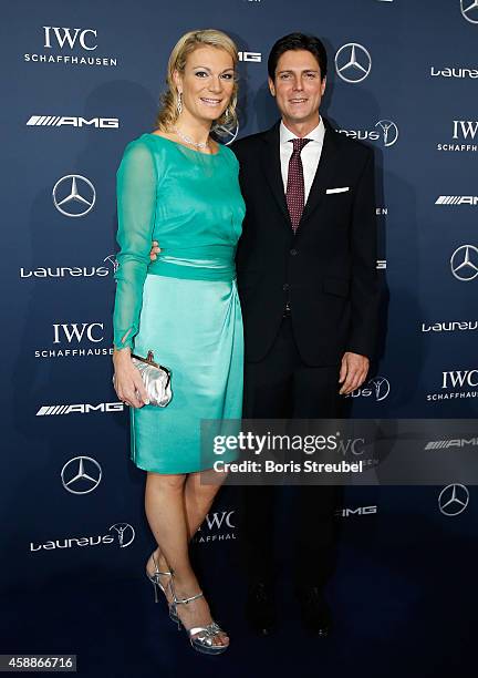 German alpine ski athlete, Maria Hoefl-Riesch and her husband Marcus Hoefl pose prior to the Laureus Media Award 2014 at Grand Hyatt Hotel on...