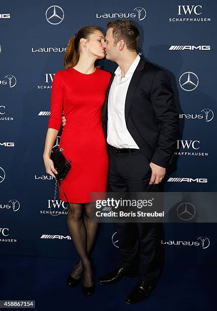 Ole Bischof, judo athlete of Germany kisses his company prior to the Laureus Media Award 2014 at Grand Hyatt Hotel on November 12, 2014 in Berlin,...