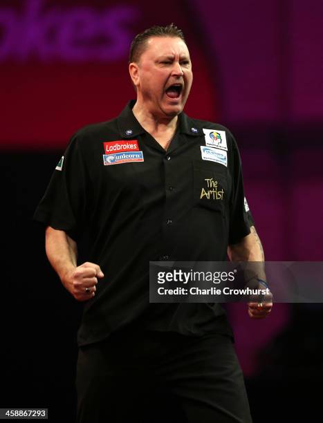 Kevin Painter of England celebrates winning a set during his second round match against Paul Nicholson of England during the Ladbrokes.com World...