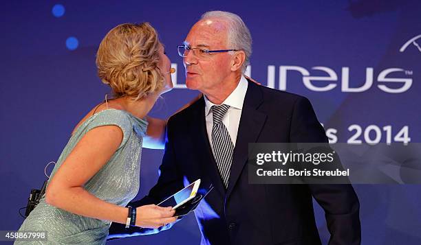 Kathi Woerndl , Austrian TV presenter and Franz Beckenbauer attend the Laureus Media Award 2014 at Grand Hyatt Hotel on November 12, 2014 in Berlin,...