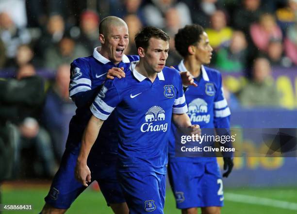 Seamus Coleman of Everton is congratulated by teammate Ross Barkley of Everton after scoring the opening goal during the Barclays Premier League...