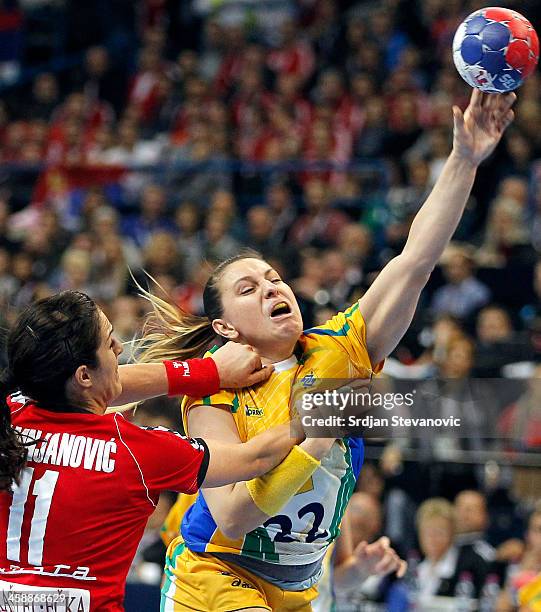 Mayara Moura of Brazil is challenged by Sanja Damnjanovic and Sanja Rajovic of Serbia during the World Women's Handball Championship 2013 Final match...