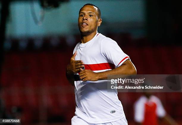 Luis Fabiano of Sao Paulo celebrates their first goal during the match between Sao Paulo and Internacional for the Brazilian Series A 2014 at Morumbi...