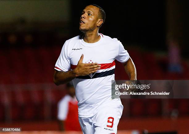 Luis Fabiano of Sao Paulo celebrates their first goal during the match between Sao Paulo and Internacional for the Brazilian Series A 2014 at Morumbi...