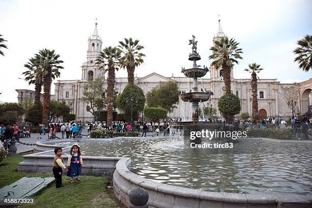 pigeons on the fountain in plaza de armas arequipa - plaza de armas stock pictures, royalty-free photos & images
