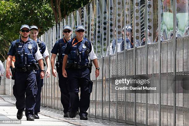 Police officers patrol around a fence near the Brisbane Convention and Exhibition Centre on November 13, 2014 in Brisbane, Australia. World economic...