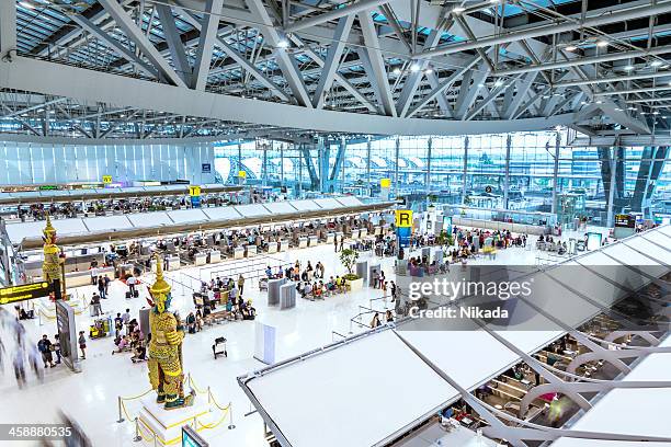 departure terminal of bangkok airport - suvarnabhumi airport stock pictures, royalty-free photos & images