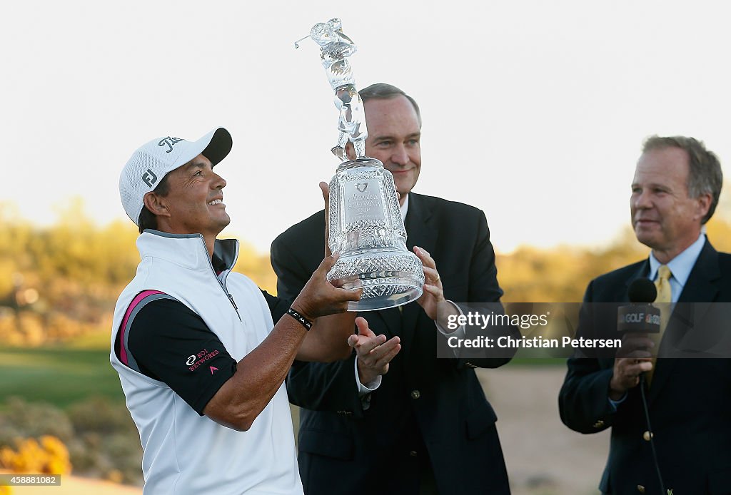 Tom Pernice Jr. is awarded the Charles Schwab Cup Championship trophy