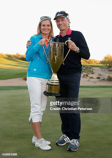 Bernhard Langer of Germany, alongside wife Vikki Carol, poses with the Charles Schwab Cup after winning the season championship which concluded in...