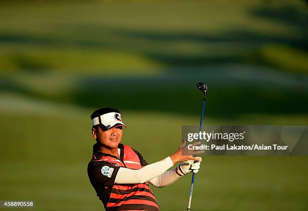 Lin Wen-tang of Chinese Taipei plays a shot during round one of the Chiangmai Golf Classic at Alpine Golf Resort-Chiangmai on November 13, 2014 in...