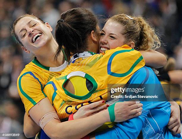 Goalkeeper Barbara Arenhart and Eduarda Amorim celebrate their victory after the World Women's Handball Championship 2013 Final match between Brazil...