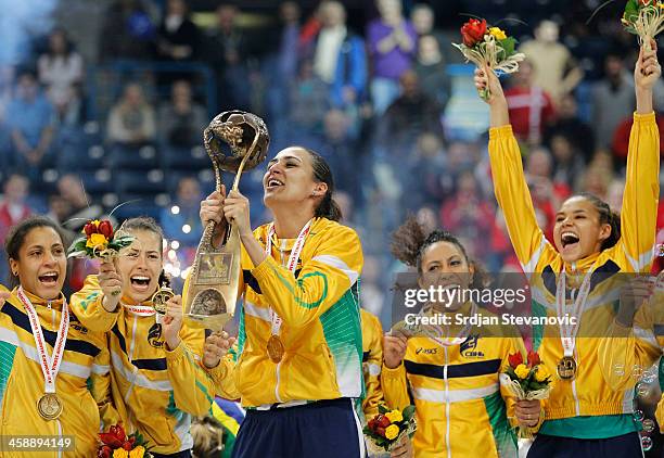 Brazil players celebrate with the trophy after beating Serbia in their World Women's Handball Championship 2013 Final match at Kombank Arena Hall on...