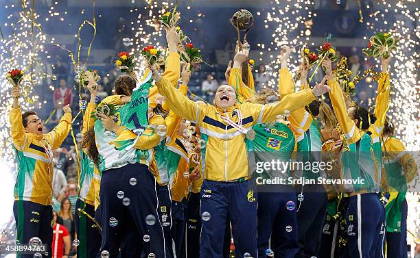 Brazil players celebrate with the trophy after beating Serbia in the World Women's Handball Championship 2013 Final match at Kombank Arena Hall on...