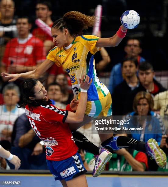 Alexandra Nascimento of Brazil in action against Sanja Damnjanovic of Serbia during the World Women's Handball Championship 2013 Final match between...