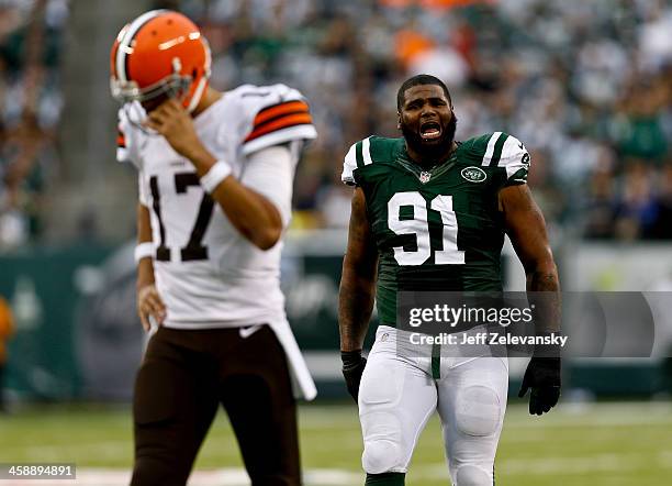 Sheldon Richardson of the New York Jets reacts after taking down Jason Campbell of the Cleveland Browns during their game at MetLife Stadium on...