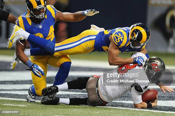 McDonald of the St. Louis Rams sacks Mike Glennon of the Tampa Bay Buccaneers in the second quarter at the Edward Jones Dome on December 22, 2013 in...