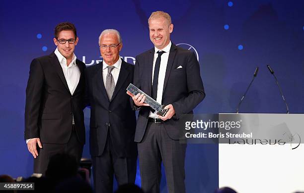 Delegators of Sport1, winner of the Laureus award 'Sprit for Laureus social project TV ' pose with Franz Beckenbauer during the Laureus Media Award...