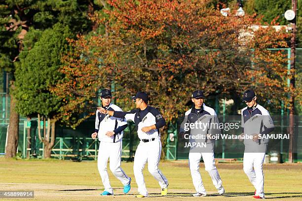 Infielders Tetsuto Yamada and Infielders Ginji and Catcher Motohiro Shima and Catcher Hikaru Ito of Samurai Japan in action during a training session...