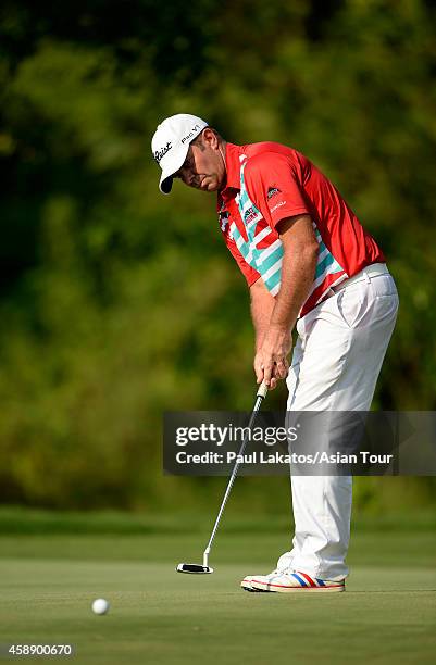 Scott Barr of Australia plays a shot during round one of the Chiangmai Golf Classic at Alpine Golf Resort-Chiangmai on November 13, 2014 in Chiang...