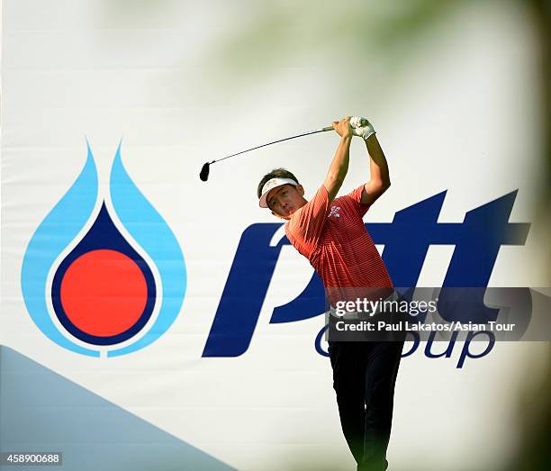 George Gandranata of Indonesia plays a shot during round one of the Chiangmai Golf Classic at Alpine Golf Resort-Chiangmai on November 13, 2014 in...