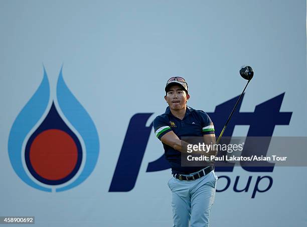 Sattaya Supupramai of Thailand plays a shot during round one of the Chiangmai Golf Classic at Alpine Golf Resort-Chiangmai on November 13, 2014 in...