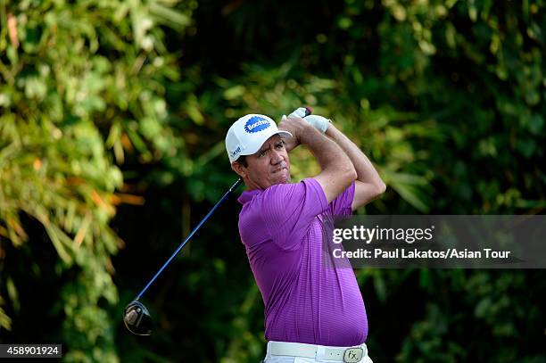 Scott Hend of Australia plays a shot during round one of the Chiangmai Golf Classic at Alpine Golf Resort-Chiangmai on November 13, 2014 in Chiang...