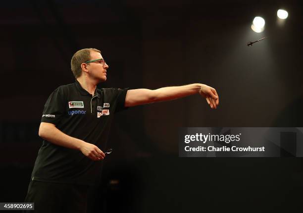 Mark Webster of Wales in action during his second round match against John Henderson of Scotland during the Ladbrokes.com World Darts Championship on...