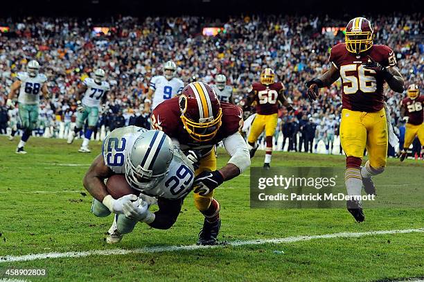 DeMarco Murray of the Dallas Cowboys scores the game winning touchdown in the fourth quarter during an NFL game against the Washington Redskins at...