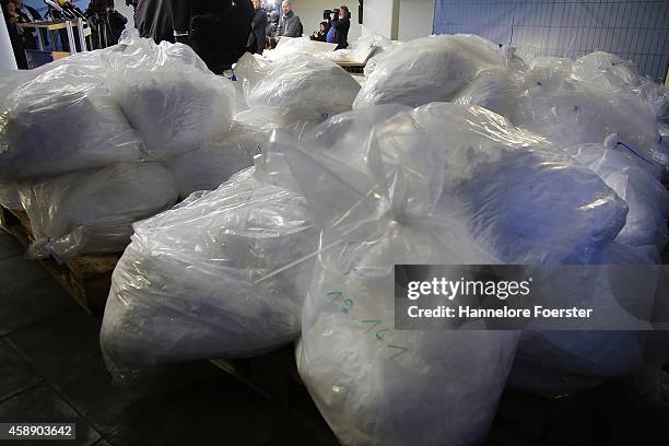 Members of the Bundeskriminalamt German law enforcement agency , the Federal Criminal Office, display portions of 2.9 tonnes of recently-confiscated...