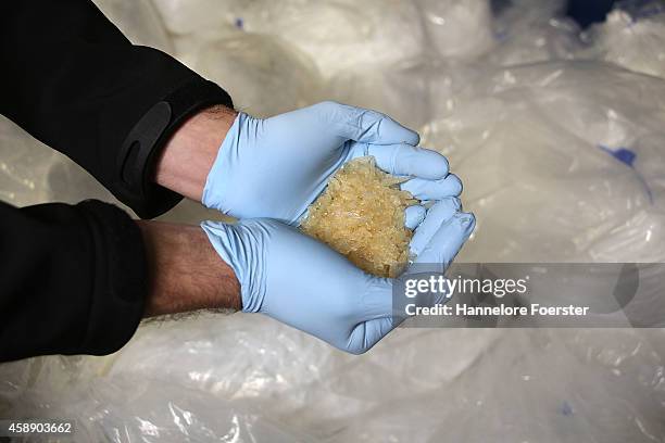 Members of the Bundeskriminalamt German law enforcement agency , the Federal Criminal Office, display portions of 2.9 tonnes of recently-confiscated...