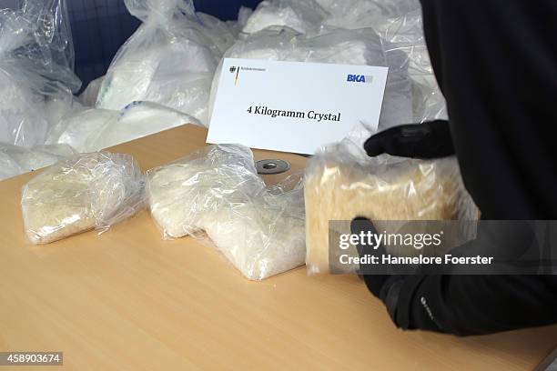 Members of the Bundeskriminalamt German law enforcement agency , the Federal Criminal Office, display portions of 2.9 tonnes of recently-confiscated...