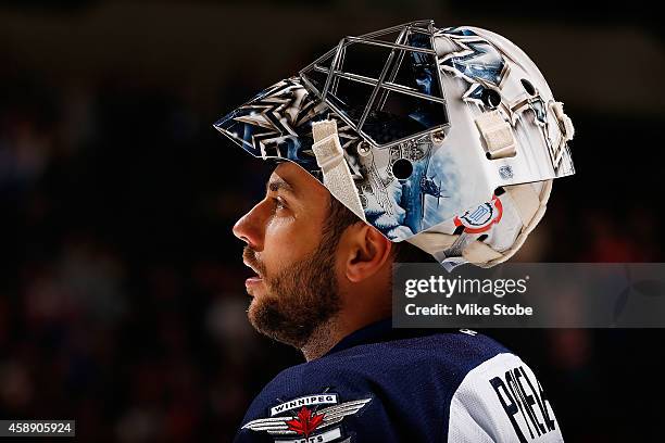 Ondrej Pavelec of the Winnipeg Jets skates against the New York Islanders at Nassau Veterans Memorial Coliseum on October 28, 2014 in Uniondale, New...