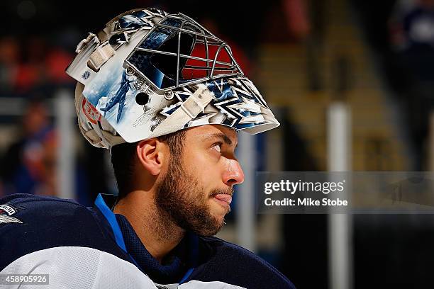 Ondrej Pavelec of the Winnipeg Jets skates against the New York Islanders at Nassau Veterans Memorial Coliseum on October 28, 2014 in Uniondale, New...