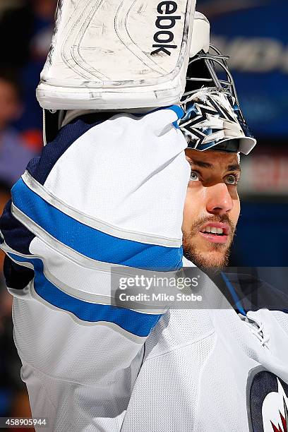 Ondrej Pavelec of the Winnipeg Jets skates against the New York Islanders at Nassau Veterans Memorial Coliseum on October 28, 2014 in Uniondale, New...