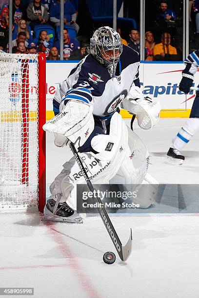 Ondrej Pavelec of the Winnipeg Jets skates against the New York Islanders at Nassau Veterans Memorial Coliseum on October 28, 2014 in Uniondale, New...