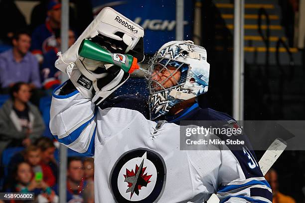 Ondrej Pavelec of the Winnipeg Jets skates against the New York Islanders at Nassau Veterans Memorial Coliseum on October 28, 2014 in Uniondale, New...