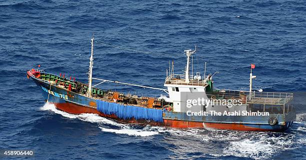 In this aerial image, a suspected Chinese coral poaching boat, whose name on the bow is painted, sails westward, at around 80km west from Chichijima...