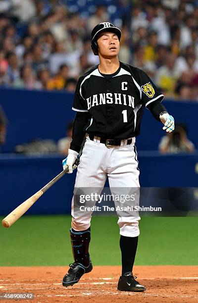 Takashi Toritani of the Hanshin Tigers reacts after strike out in the top of 5th inning during the Central League game between Hanshin Tigers and...