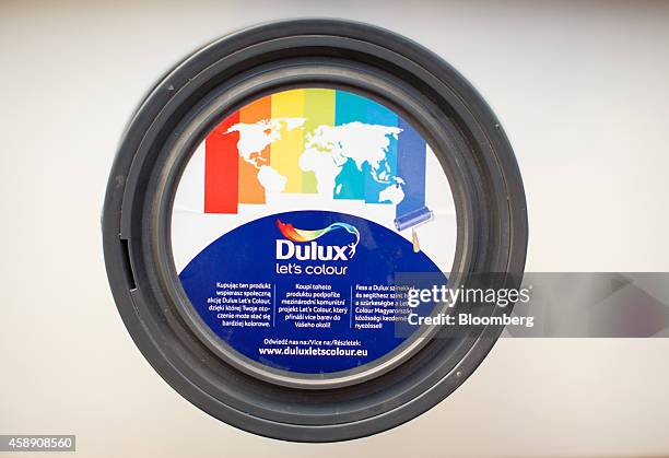 The lid of a tin of Dulux paint, manufactured by Akzo Nobel NV, sits on display at the company's headquarters in Amsterdam, Netherlands, on Thursday,...