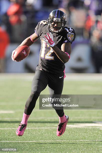 Jacoby Jones of the Baltimore Ravens runs with the ball during a NFL football game against the Atlanta Falcons at M&T Bank Stadium on October 19,...