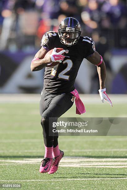 Jacoby Jones of the Baltimore Ravens runs with the ball during a NFL football game against the Atlanta Falcons at M&T Bank Stadium on October 19,...