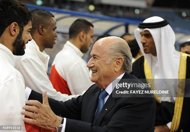 President Joseph Blatter greets Yemeni national team players prior to their Gulf Cup football match against Bahrain at King Fahad stadium in Riyadh...