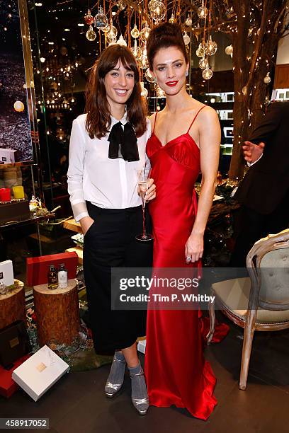 Laura Jackson and model Eve attend 'The Molton Brown Splendid Christmas' Party' at the flagship store on Regent Street on November 13, 2014 in...