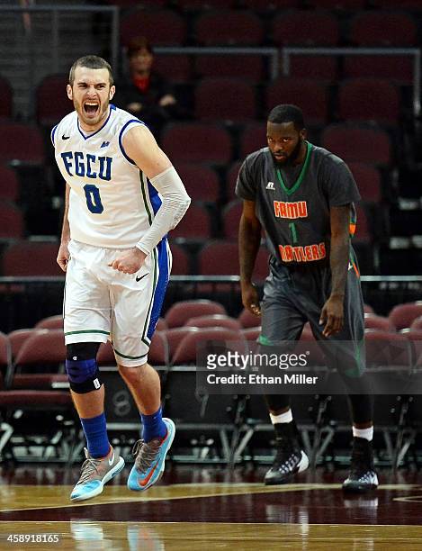 Brett Comer of the Florida Gulf Coast Eagles celebrates after a late score as Willie Connor III of the Florida A&M Rattlers looks on during the 2013...