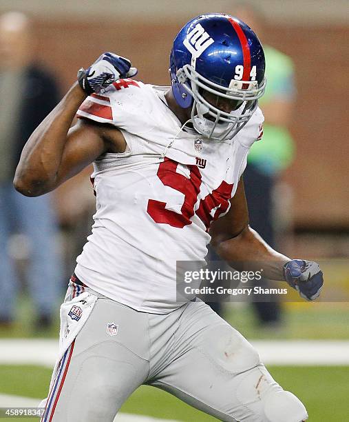Mathias Kiwanuka of the New York Giants reacts after a fourth quarter sack while playing the Detroit Lions at Ford Field on December 22, 2013 in...
