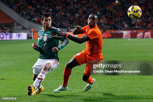 Quincy Promes of Netherlands and Jesus Corona Ruiz of Mexico battle for the ball during the international friendly match between Netherlands and...