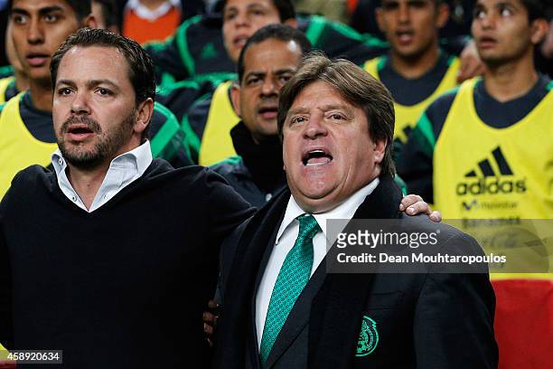Mexico Head Coach / Manager, Miguel Herrera and his staff sing the national anthem prior to the international friendly match between Netherlands and...
