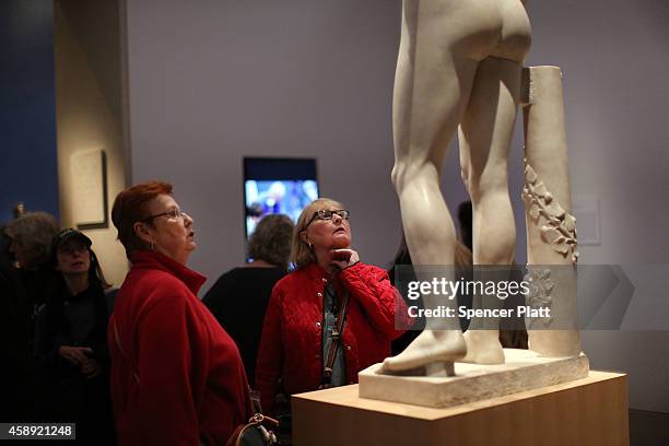 Visitors look up at the marble statue named Adam, created in the 1490s by Italian Renaissance artist Tullio Lombardo, at the Metropolitan Museum of...