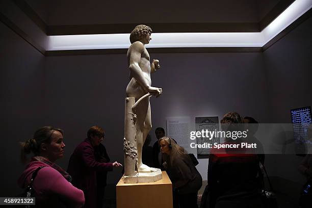The marble statue named Adam, created in the 1490s by Italian Renaissance artist Tullio Lombardo, stands on display at the Metropolitan Museum of Art...