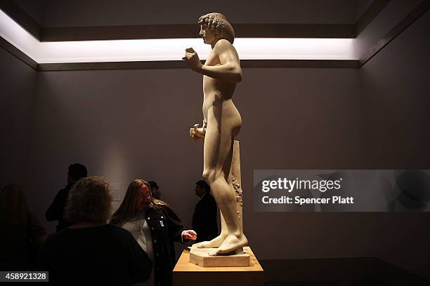 The marble statue named Adam, created in the 1490s by Italian Renaissance artist Tullio Lombardo, stands on display at the Metropolitan Museum of Art...